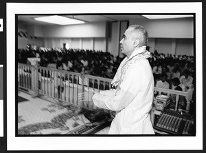 Priest (Brahmin) in Hindu temple, BAPS Shree Swaminarayan Mandir, Bertlett, Il., July, 28, 2002 4pm