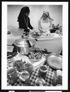 Women cutting up food, Los Angeles, 1999