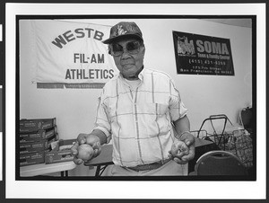 Man of Filipino origin inside the West Bay Area Pilipino Multi-Service Center, SOMA, San Francisco, California, 2002