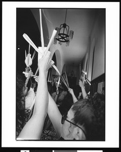 People holding up palms on Palm Sunday at St. Thomas Church (Los Angeles, Calif.), 1996