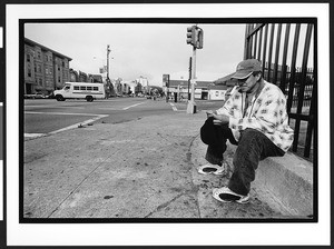 A man of South American origin waiting for day work (Listo) on Cesar Chavez Street. San Francisco, California, 2002