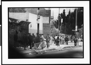 Homeless persons gathering on the sidewalk, Skid Row, Los Angeles, 1996