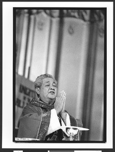 Monsignor Fred Al. Bitanga of Filipino origin, celebrating mass, Saint Patrick's Catholic Church, San Francisco, California, 2002