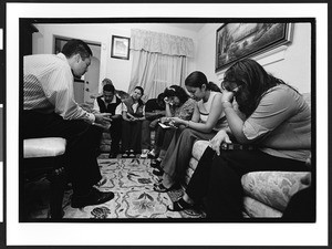 Prayer group sponsored by the Church of God, with people of South American origin, in a private home, Richmond, California, 2002