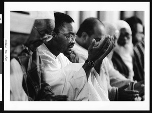 Man raising hands in prayer, Los Angeles, 1999