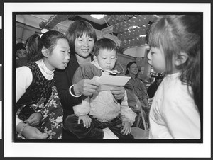 Mother and children of Chinese origin, Cameron House, Family Day, Chinatown, San Francisco, California, 2002