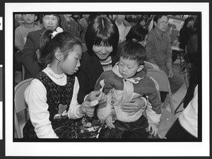 Mother and children of Chinese origin, Cameron House, Family Day, Chinatown, San Francisco, California, 2002