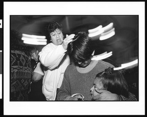 People in prayer during mass at Saint Thomas Church (Los Angeles, Calif.), 1996