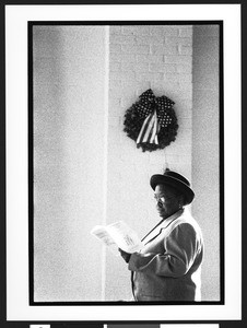 Middle aged African-American woman holding a church service program, Zion Lutheran Church, Takoma Park, Maryland