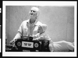 Woman worshiping with child, Los Angeles, 1999