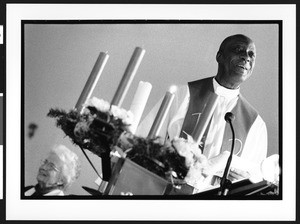 Reverand Julius Coker standing at the altar, Zion Lutheran Church, Takoma Park, Maryland