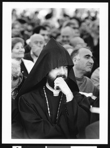 Priest in black hood, Los Angeles, 1999