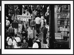 Crowds of people walking on Sacramento Street, Chinatown, San Francisco, California, 2002