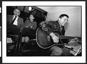 Man singing and playing guitar during chuch service, Sligo Baptist Church, 1610 Dennis Avenue,Silver Spring, Maryland, 2002