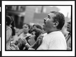 A man, of Latin American origin, at outdoor prayer meeting, Charismatic, Maternity B.V.M., Chicago, Il., 2002