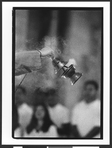 Close up of censer and hand during mass, Saint Patrick's Catholic Church, San Francisco, California, 2002