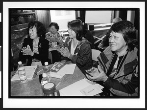 Women of Chinese origin applaud after lecture, Cameron House, Family Day, Chinatown, San Francisco, California, 2002