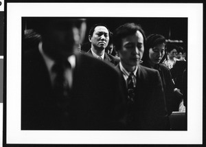 Man praying in church service, Oriental (Los Angeles), 1996