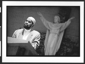 Muslim Imam preaching at Saint Mary Queen of Sorrows Church Thanksgiving service, Fairfax, Virginia, November 27, 2002, 8pm