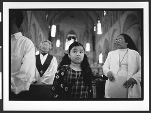 People of Filipino origin attending mass, interior of Saint Patrick's Catholic Church, San Francisco, California, 2002