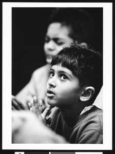 Young boy praying, Los Angeles, 1999