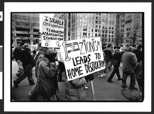 Muslim men and women march down Pennsylvania Avenue protesting Israeli occupation of Palestine, Washington D.C., 2002