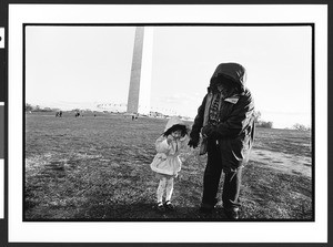 Woman and child of Chinese origin in front of the Washington Monument, The Elipse, Washington, D.C., 2002