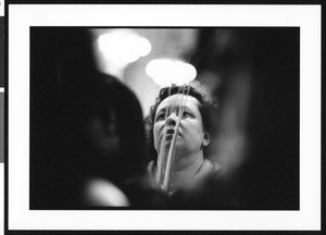 Woman with palms at St. Vincent Catholic Church (Los Angeles, Calif.) on Palm Sunday, 1996