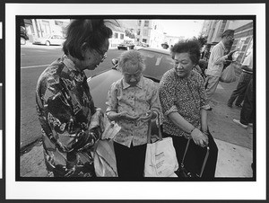 Elderly women of Filipino origin outside of West Bay Pilipino Multi-Service Center, SOMA, San Francisco, California, 2002