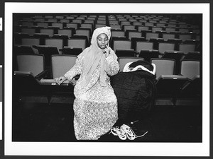 Woman waiting before EID celebration, D.C. Convention Center, Washington, D.C., 2002