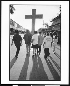 People carrying a cross during an anti-violence march, 1996