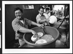 Man of Vietnamese origin washing dishes, Chua Duc Vien Pagoda, or Perfect Harmony Temple, San Jose, California, 2002