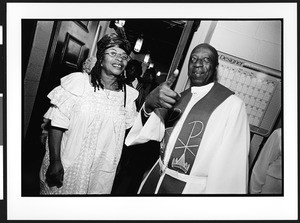 Reverend Julius Coker greets parishioners after church service, Zion Lutheran Church, Takoma Park, Maryland