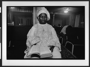 A woman of African origin attending services, Saint James Healing Church of Christ, Bladensburg, Maryland