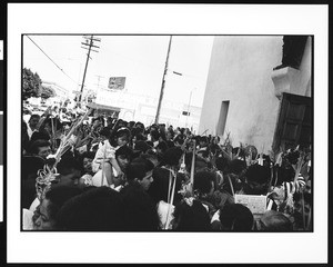 Group of worshipers outside church with palm fronds on Palm Sunday, St. Thomas Church, Los Angeles, 1996