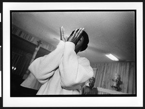 A woman of African origin praising God at Saint James Healing Church of Christ, Bladensburg, Maryland