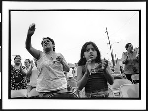 Worshipers of Latin American origin at outdoor prayer meeting, Charismatic, Maternity B.V.M., Chicago, Il., 2002