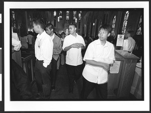 Four young men of Filipino origin exiting mass, Saint Patrick's Catholic Church, San Francisco, California, 2002