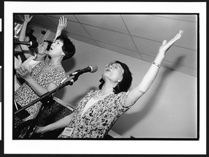 Three women of Chinese origin singing at Truth Lutheran Church, Naperville, Illinois, 2002