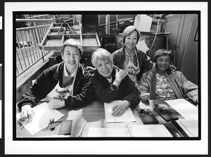 Four people of Chinese origin at food distribution table, Cameron House, Chinatown, San Francisco, California, 2002