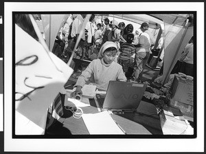 Nun of Vietnamese origin working on computer, Our Lady of Peace, San Jose, California, 2002