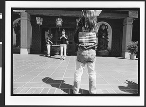 Girl of Vietnamese origin standing in front of Chua Duc Vien Pagoda, or Perfect Harmony Temple, San Jose, California, 2002