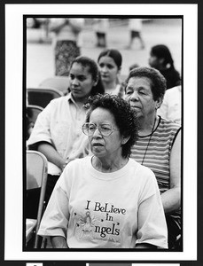 Female worshipers of Latin American origin at outdoor prayer meeting, Charismatic, Maternity B.V.M., Chicago, Illinois, 2002