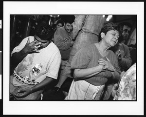 People in prayer during mass at Saint Thomas Church (Los Angeles, Calif.), 1996