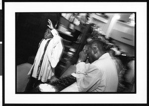 People in prayer at the First African Methodist Episcopal Church (Los Angeles, Calif.), 1996