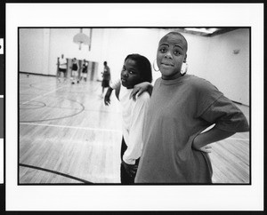 Two girls on a basketball court, 1996