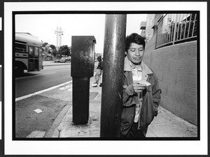 Men of South American origin waiting for day work (Listo) on Cesar Chavez Street, San Francisco, California, 2002