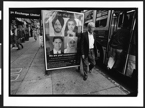 Bus stop poster, "We Are Not The Enemy", showing faces of different ethnicities, San Francisco, California, 2002