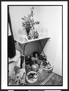 View of objects of Santeria practise. Marissa, a Santeria priestess, also known as a lyalrishas, or mother of Orisha, the Santeria god, interior of a closet holding objects of her altar in her home, 399 NW 72nd Avenue & 3rd Street, Miami, Florida, 2002