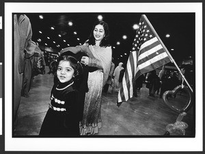 Woman and child before EID celebration, D.C. Convention Center, Washington, D.C., 2002